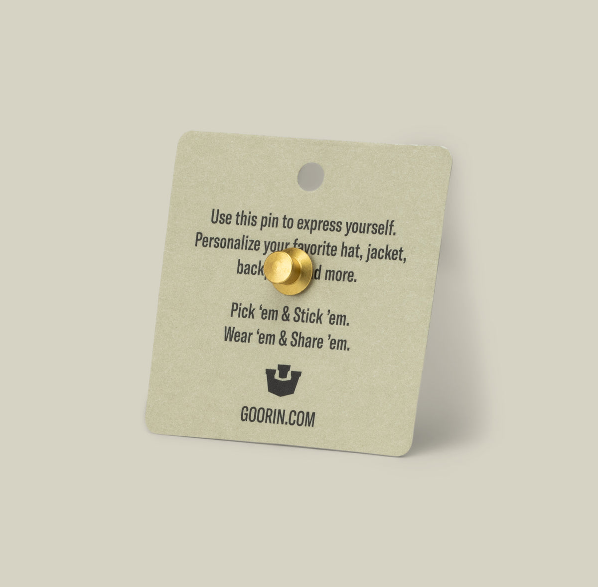 The Goorin Bros. Rooster Trucker Pin is shown on a square card with usage instructions, set against a plain background.