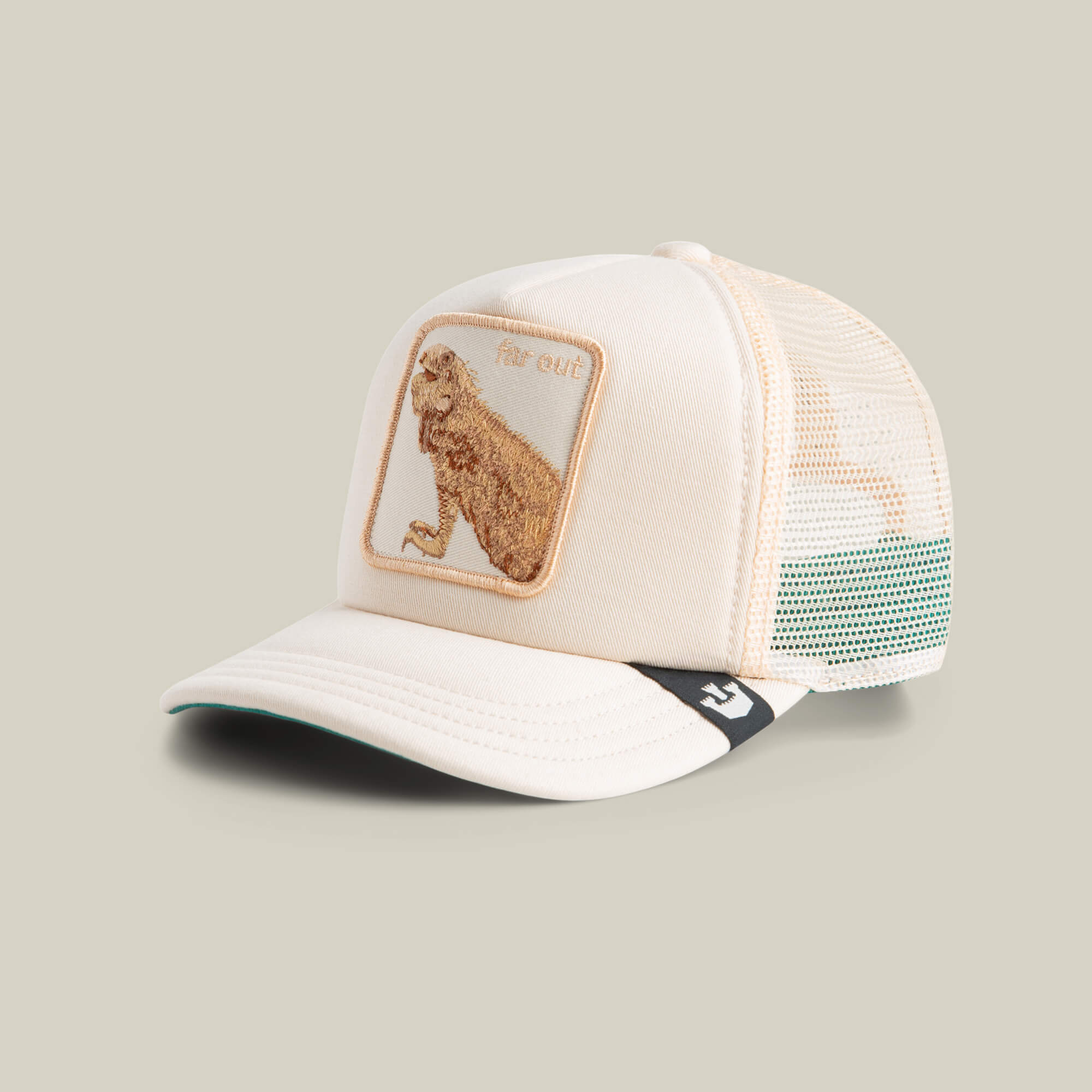 The Lil Far Out by Goorin Bros. is a cream mesh trucker hat that's breathable and stylish, featuring a front bear patch with "far out" embroidered above.
