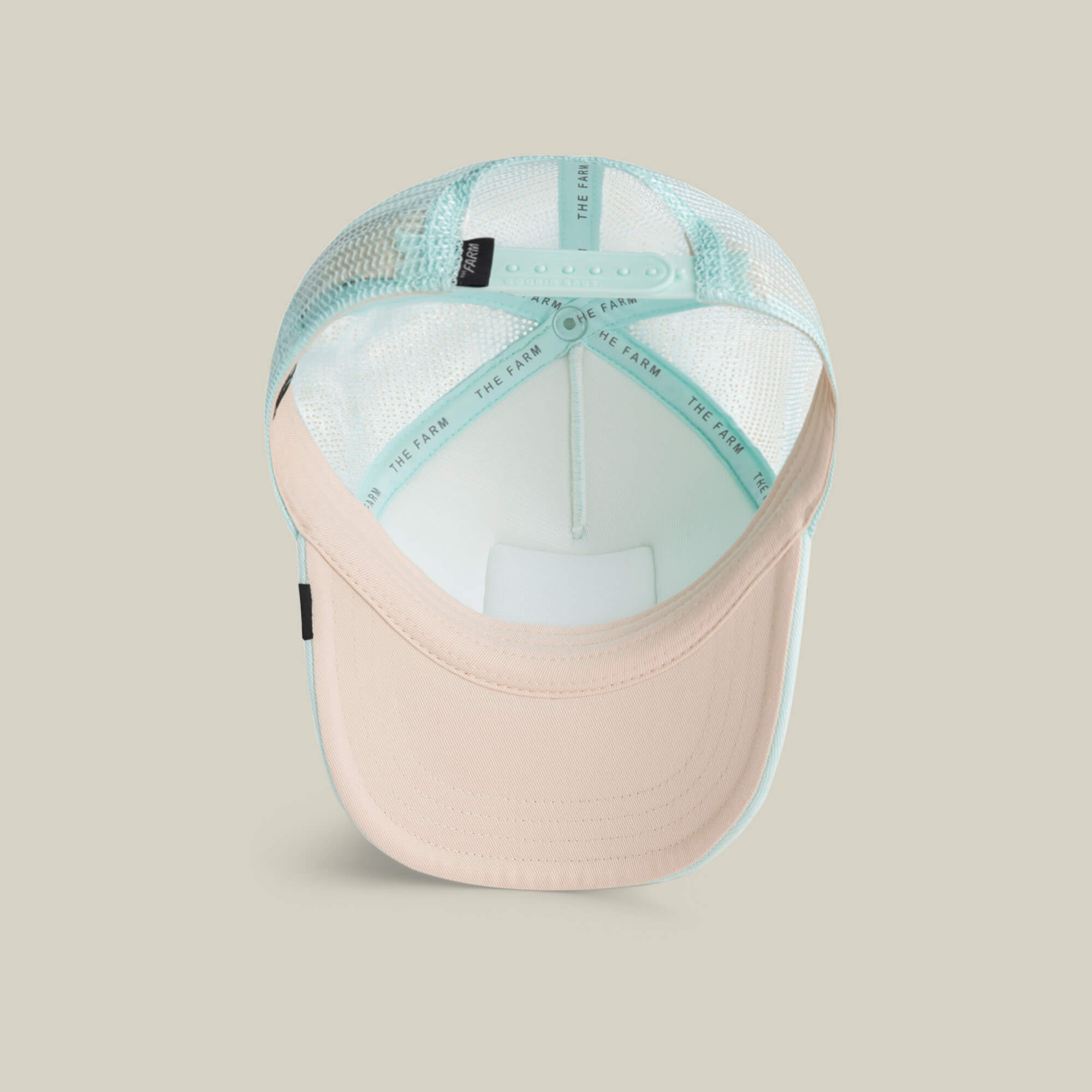 The Goorin Bros. Lil Squad kids cap features a light blue and beige mesh back, an adjustable snap closure, printed branding on the sweatband, and an embroidered flamingo—perfect for true squad goals style.