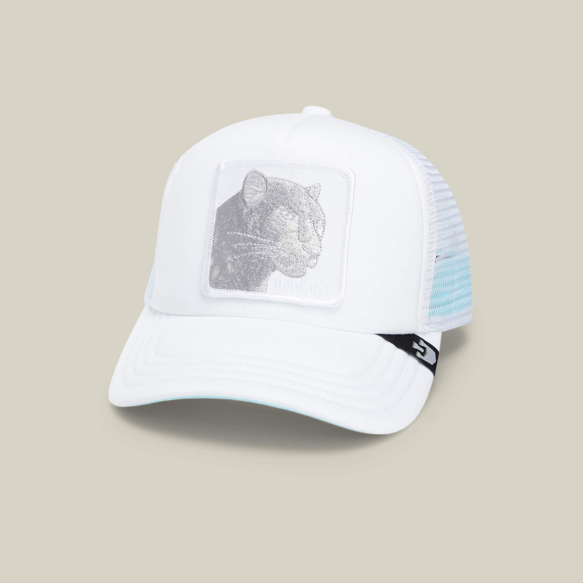 The Lil Pantherino by Goorin Bros. is a white trucker hat featuring a breathable mesh back and an embroidered panther patch, perfect for adding bold style to any outfit.
