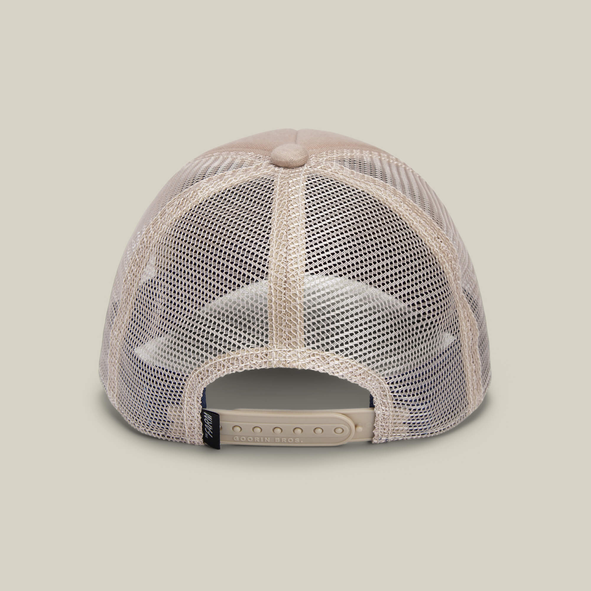 The Goorin Bros. OK Zoomer is a beige mesh hat for kids, shown from the rear with an adjustable snap closure.
