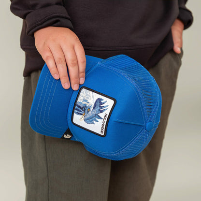 A person holding a Goorin Bros. Hollywood Rooster Mini blue mesh baseball cap with a rooster patch, standing next to electric blue shoes.