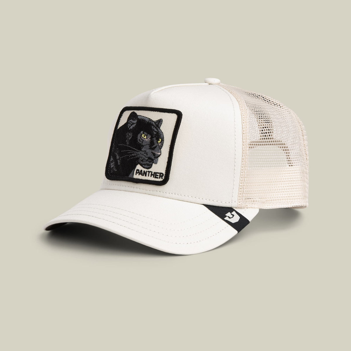 The Panther Trucker Mini by Goorin Bros is a white mesh snapback cap featuring a black embroidered panther patch with gold eyes on the front and a black branded strap at the back, shown on a neutral studio background.