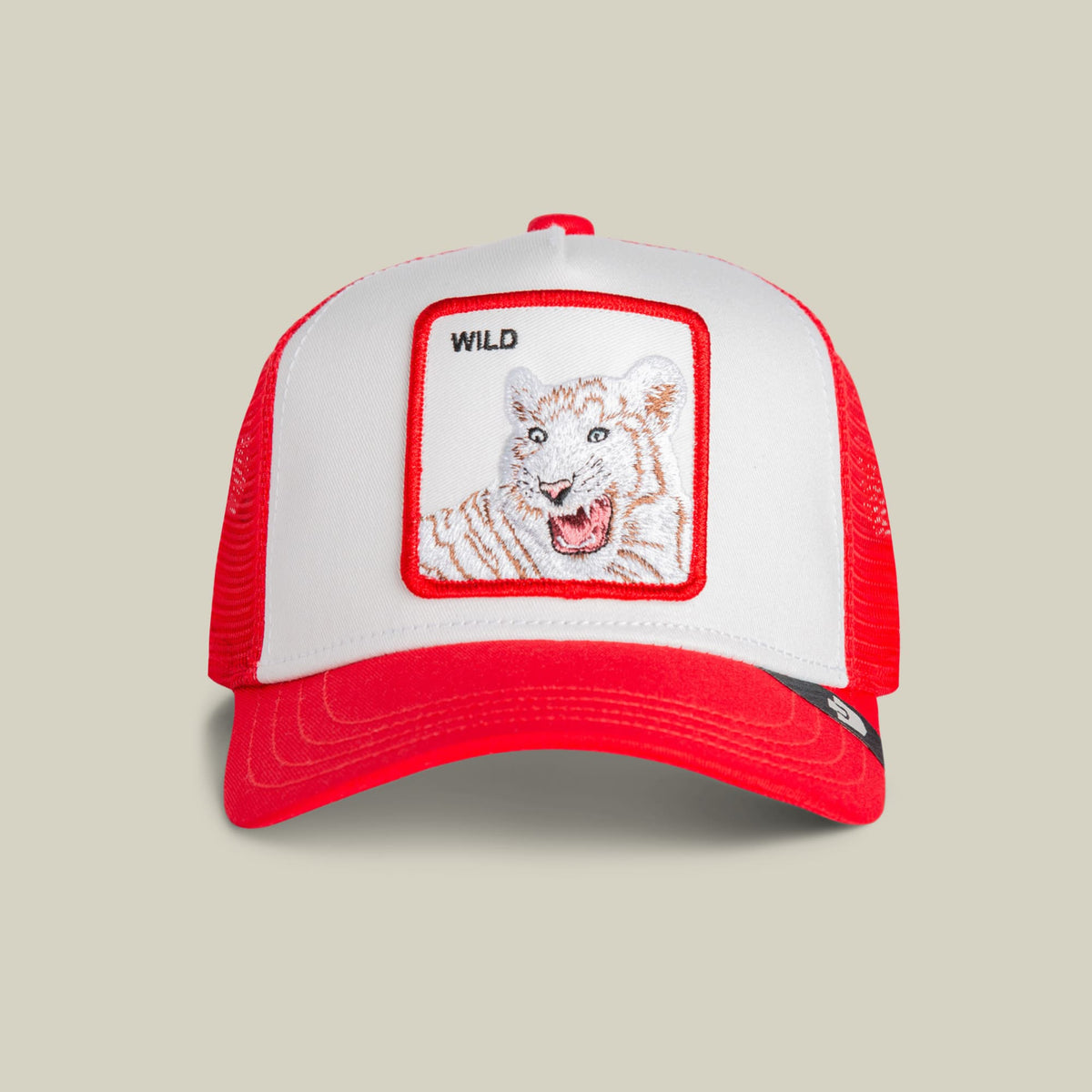 The Goorin Bros. Wild Tiger Mini is a red and white trucker hat featuring an embroidered tiger patch on the front with the word "Wild" above it, shown against a neutral background.