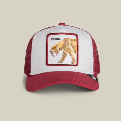 The Goorin Bros. Fierce Saber-tooth Tiger Mini is a red and white mesh trucker hat featuring an embroidered patch of a fierce saber-tooth tiger with the word "Fierce" on the front panel, displayed against a neutral background.