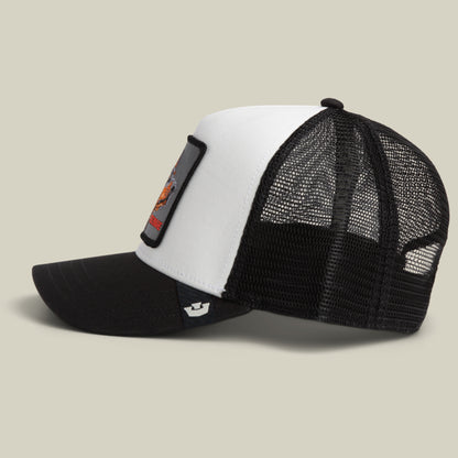 Black and white Beware Trucker Mini mesh hat by Goorin Bros., featuring a curved bill and an embroidered “Doberman on duty” patch on the front panel, displayed on a neutral background.