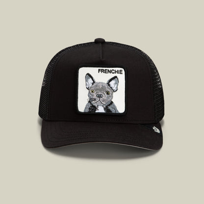 The Goorin Bros. Frenchie Trucker Mini is a black mesh-back trucker hat featuring a white embroidered patch with a detailed French Bulldog illustration and "FRENCHIE" text on the front.