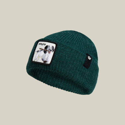 The Playful Beanie Mini by Goorin Bros. is a dark green kids’ knit hat featuring a dog patch and "playful," plus a black tag with white logo—perfect for keeping little ones cozy and stylish all season.