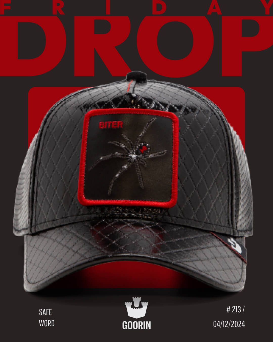 Black quilted baseball cap with a red and black spider patch on the front, displayed against a dark background with bold red text reading FRIDAY DROP. Quality craftsmanship you expect from Goorin, known for premium hats.