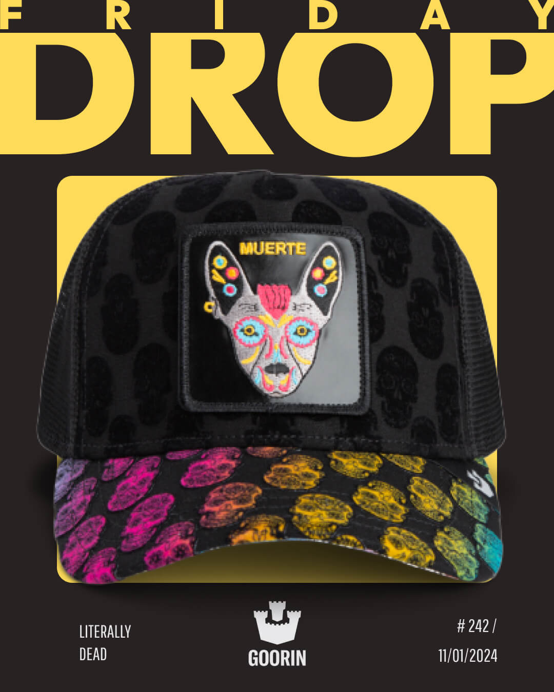 A bold hat design from Goorin, this black mesh trucker hat features a colorful embroidered animal face patch labeled MUERTE and multicolored skull patterns, displayed against a striking yellow and black FRIDAY DROP background.