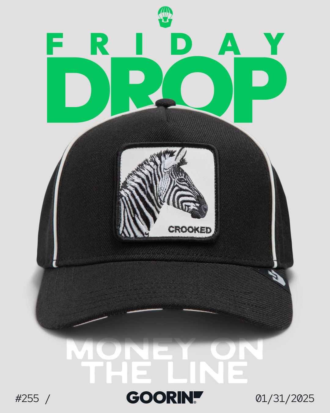 A black Goorin Bros. trucker hat with a zebra patch and the word “CROOKED” is displayed under bold green FRIDAY DROP text, with “MONEY ON THE LINE” below—perfect for fans of bold hat designs.