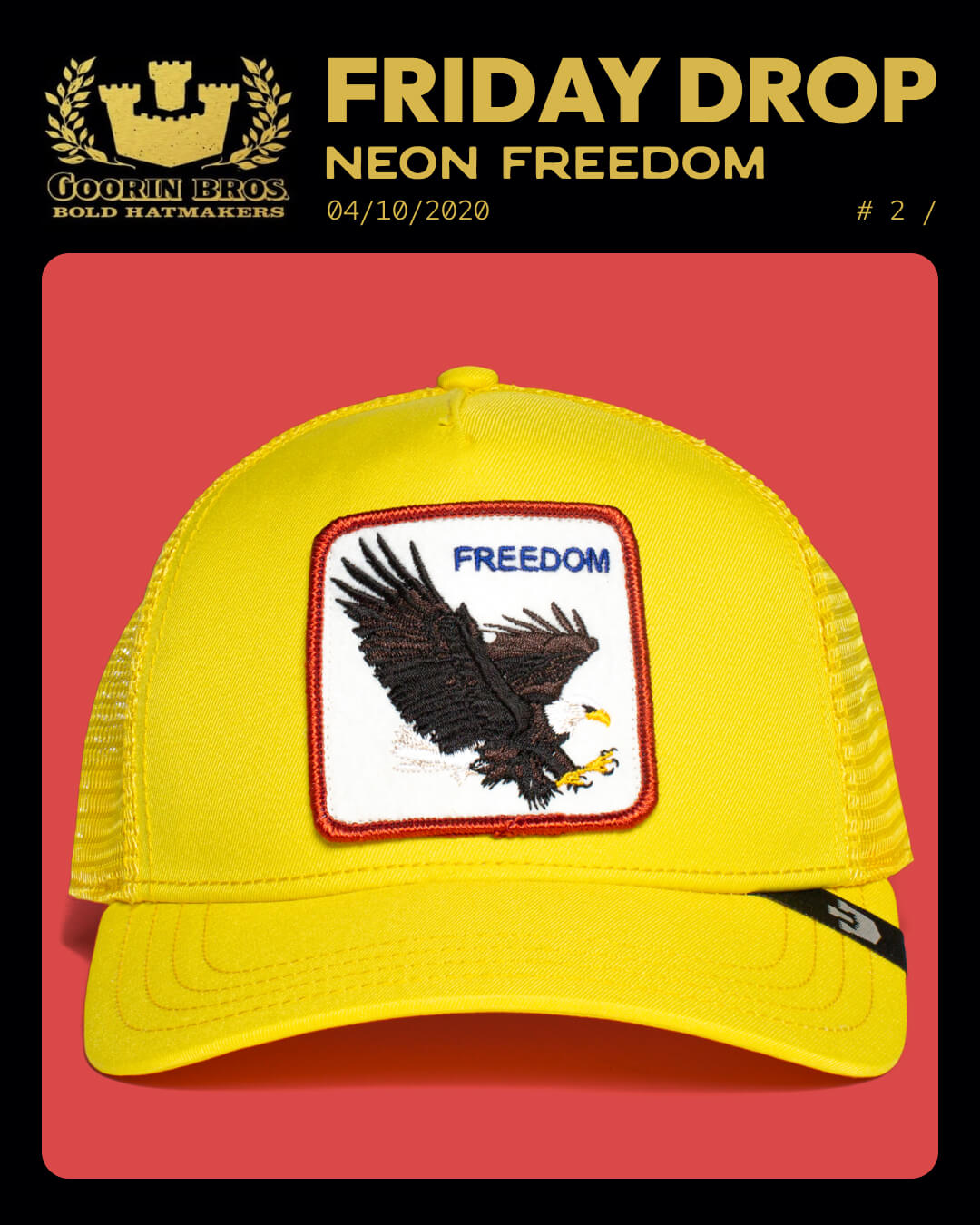 A yellow trucker hat with a patch showing a bald eagle and the word “FREEDOM” on the front, displayed on a red background.