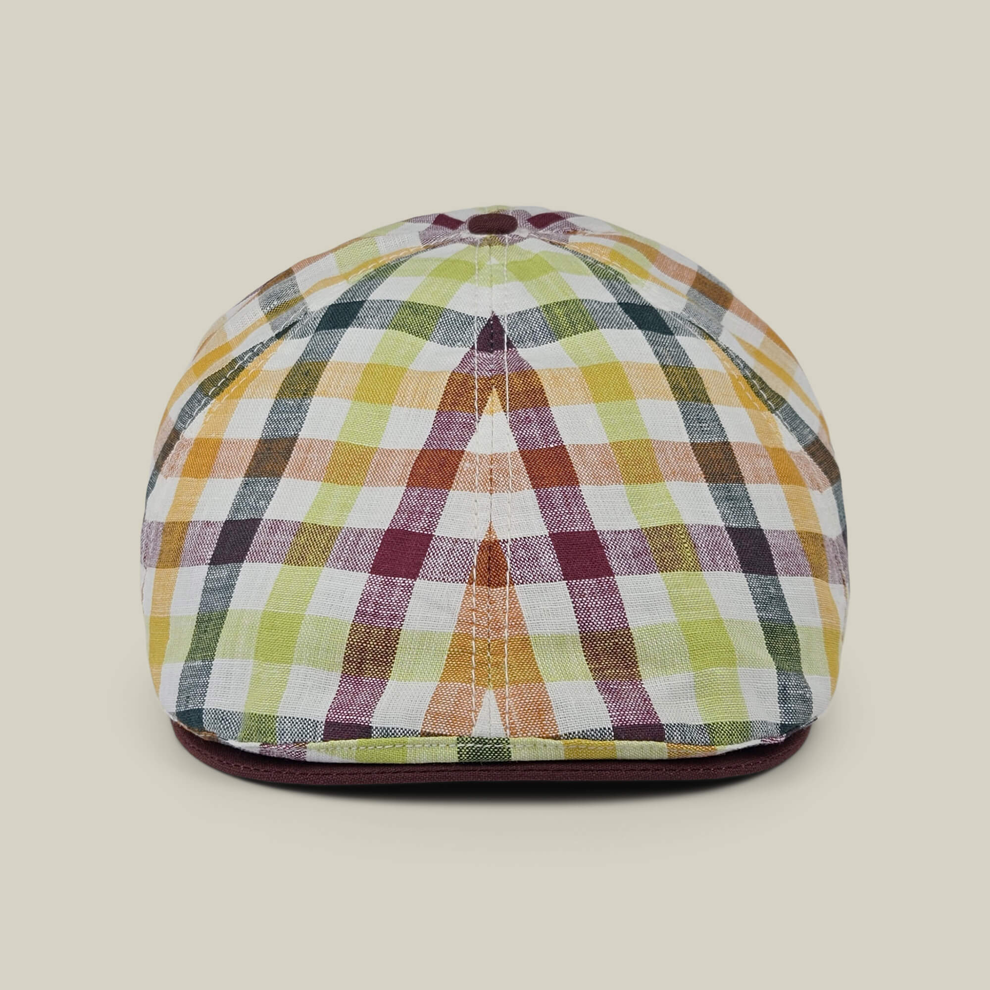 The “Point Lobos” by Goorin Bros. is a multicolored plaid 6 panel Ivy flat cap, handmade in the USA from a breathable cotton blend, displayed upright on a plain beige background.