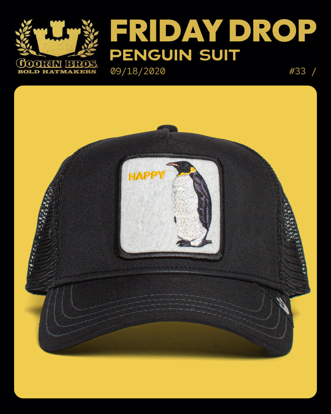 A black mesh trucker hat by Goorin Bros., labeled Penguin Suit, features a patch of a penguin and the word HAPPY in yellow. Displayed on a yellow background, it's perfect for fans of unique trucker hats.