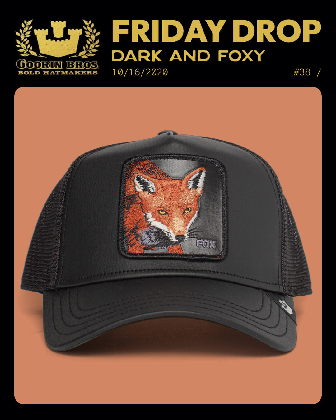 A black mesh trucker hat featuring a patch with an embroidered fox and the word FOX on the front panel, displayed against a brown background—perfect for those who appreciate bold hat designs.
