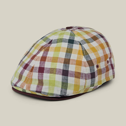 The Goorin Bros. Point Lobos is a 6-panel Ivy flat cap featuring a multicolored plaid pattern in shades of yellow, orange, green, and burgundy. Handmade in the USA from a breathable cotton blend, this stylish cap is showcased against a plain beige background.