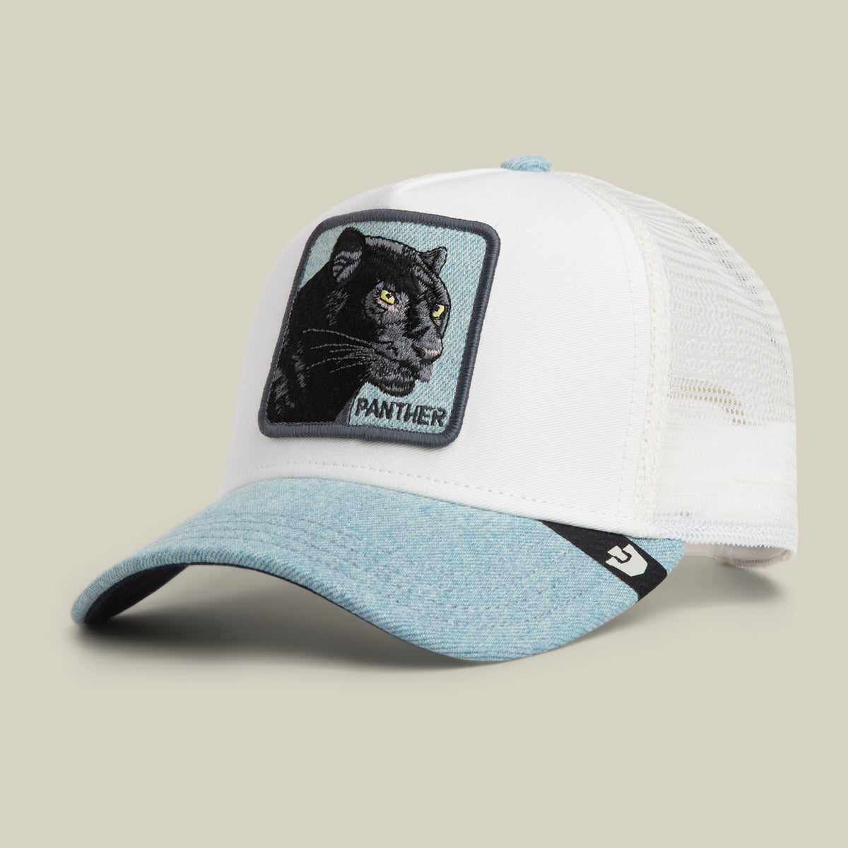 The Denim Panther trucker hat by Goorin Bros. features a white and light blue design with a denim brim and mesh back, highlighted by a rectangular patch of a black panther head and the word “PANTHER” embroidered on the front.