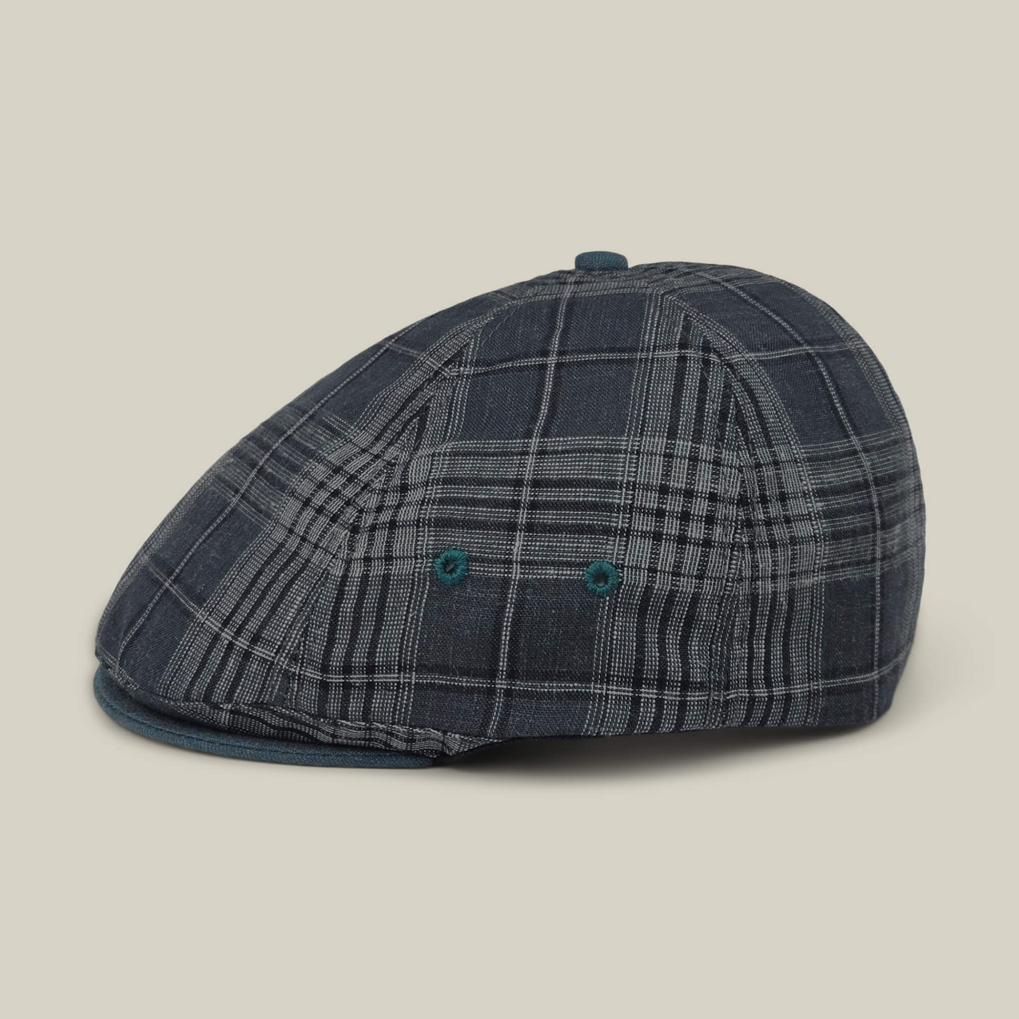 The Goorin Bros. Point Lobos is a blue plaid 6-panel Ivy flat cap featuring a rounded crown, short brim, and two ventilation eyelets on the side, crafted from a breathable cotton blend and showcased against a plain light background.