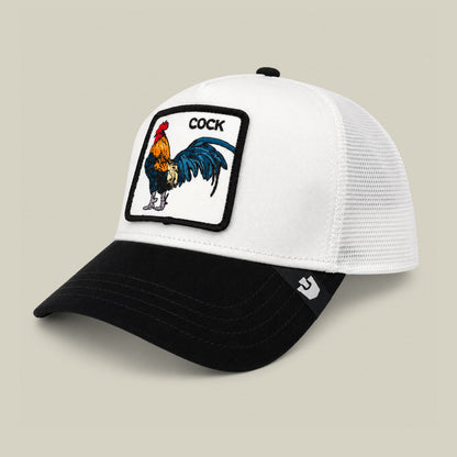 The Goorin Bros. Suede Colorful Rooster trucker hat features a white mesh back and black suede front with a colorful embroidered rooster patch on the crown, displayed against a neutral background.