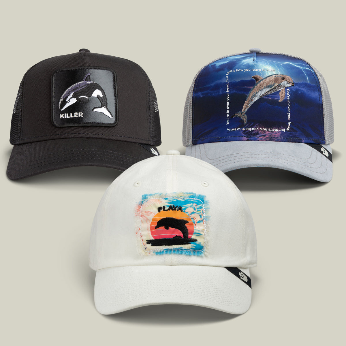 Make a splash with the Water World Bundle by Goorin Bros.: this trio features a black cap with an orca killer patch, a grey cap with a dolphin underwater graphic, and a white cap showing off a colorful sunset with an orca—an ocean-inspired collection that’s perfect together.