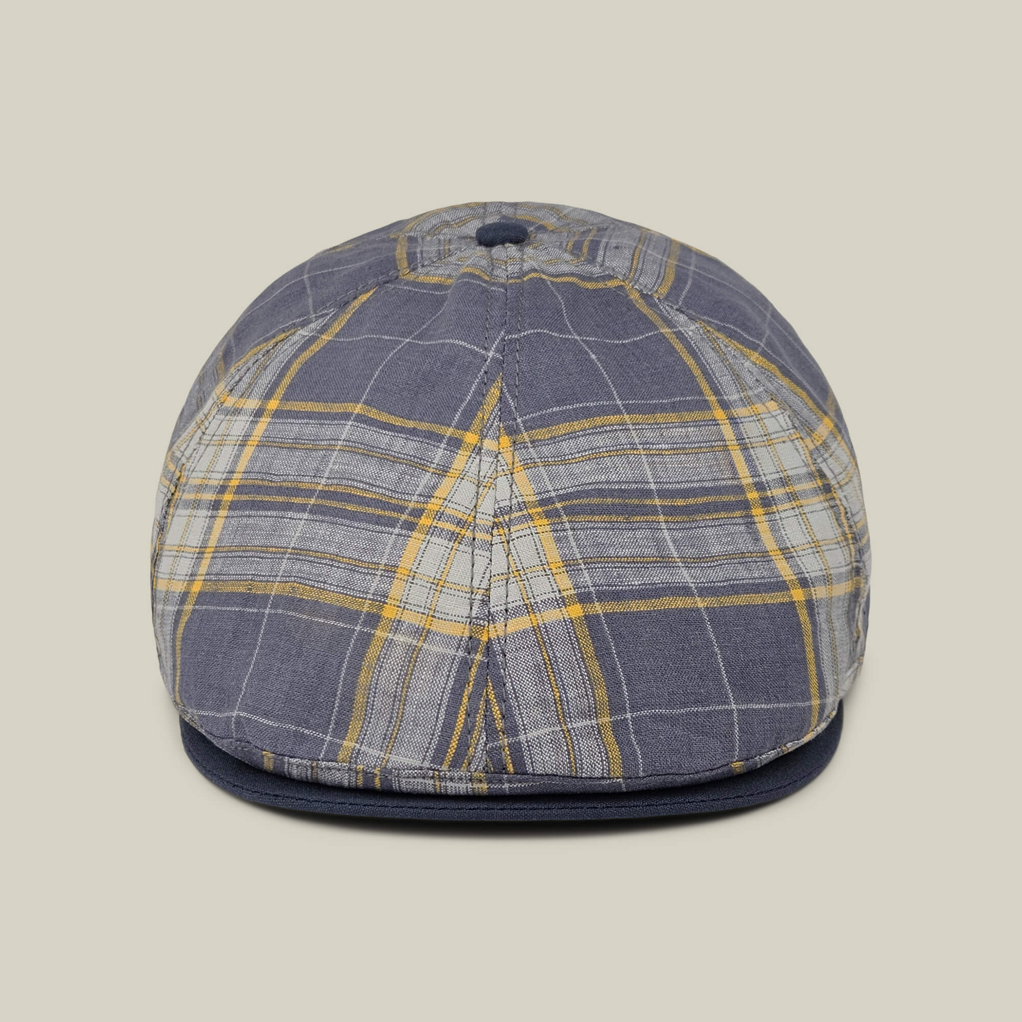 Front view of the Point Lobos 6 Panel Ivy flat cap by Goorin Bros., featuring a blue, gray, and yellow plaid pattern with a button on top, expertly handmade in the USA from a breathable cotton blend, shown against a neutral background.