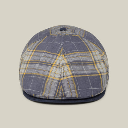 Front view of the Point Lobos 6 Panel Ivy flat cap by Goorin Bros., featuring a blue, gray, and yellow plaid pattern with a button on top, expertly handmade in the USA from a breathable cotton blend, shown against a neutral background.