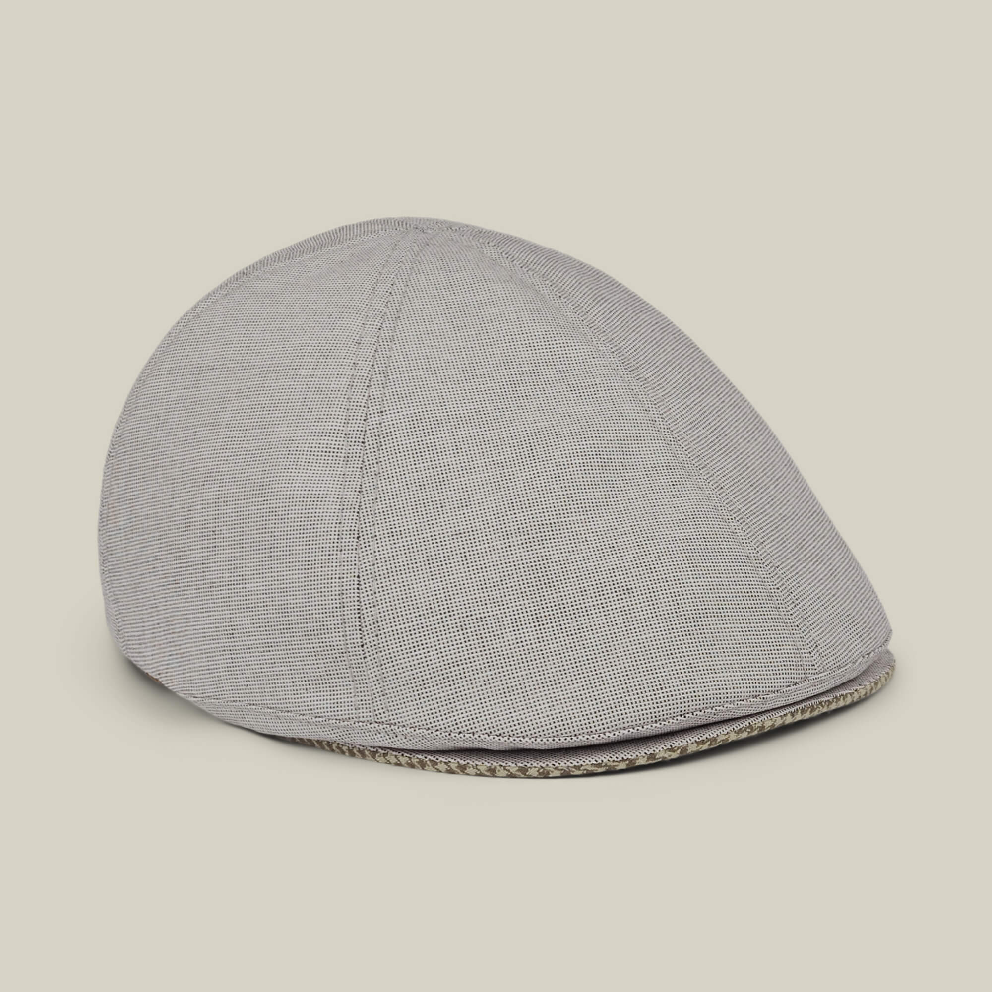 The Mile Rock by Goorin Bros. is a gray 6-panel Ivy flat cap crafted from textured fabric, hand cut and sewn in the USA. Displayed against a plain light background, the hat highlights its curved shape and soft structure.